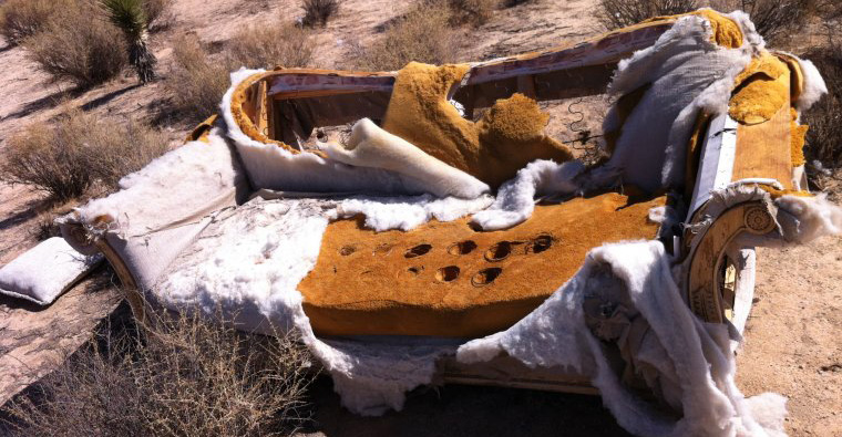 UltimateGraveyard busted couch at dusk in Mojave Desert. Available for filming, photography productions.